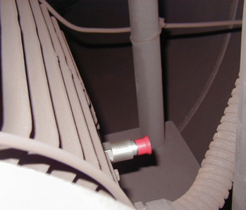 A CTC top exit sensor with red sensor cap mounted horizontally on a motor fin.