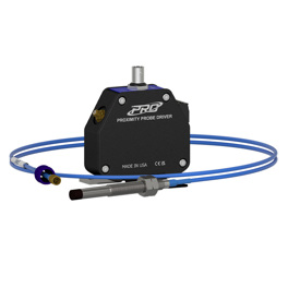 A black 8 mm proximity probe driver with navy blue faceplate surrounded by an 8 mm proximity probe on a blue extension cable.